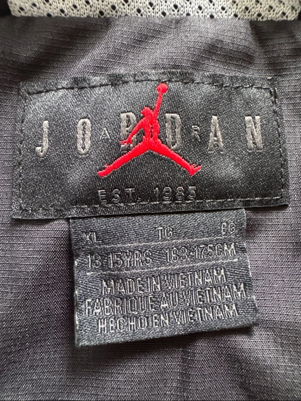 Air Jordan Black, hooded Windbreaker Jacket with Neon Zip. Youth Size XL